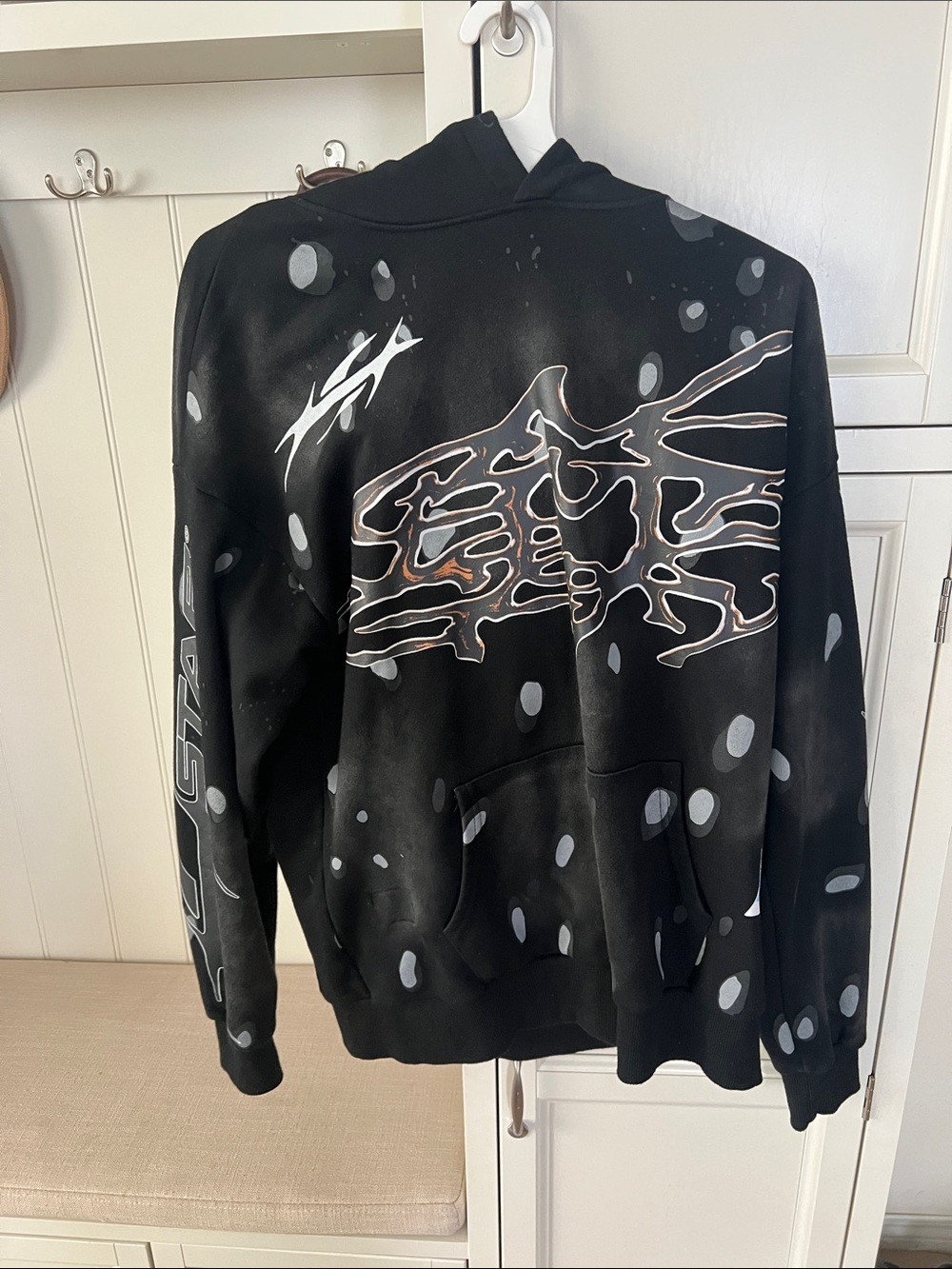 Black Hoodie with Abstract Skeleton Graphic